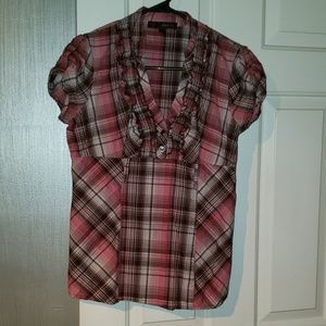 2 shirts, one with a belt